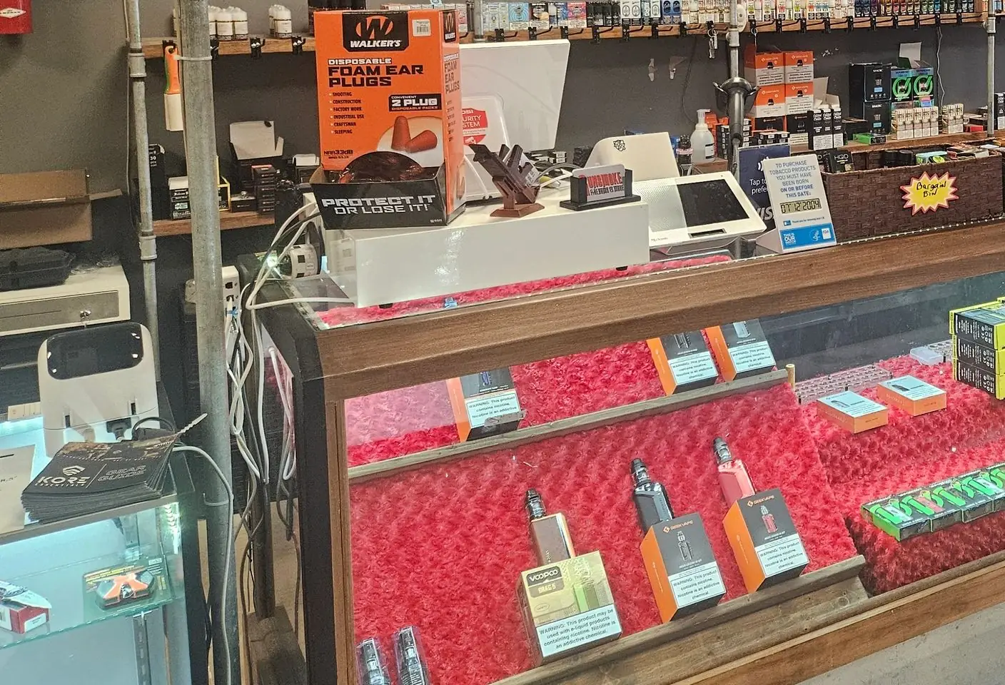 Vape mods in the red display case