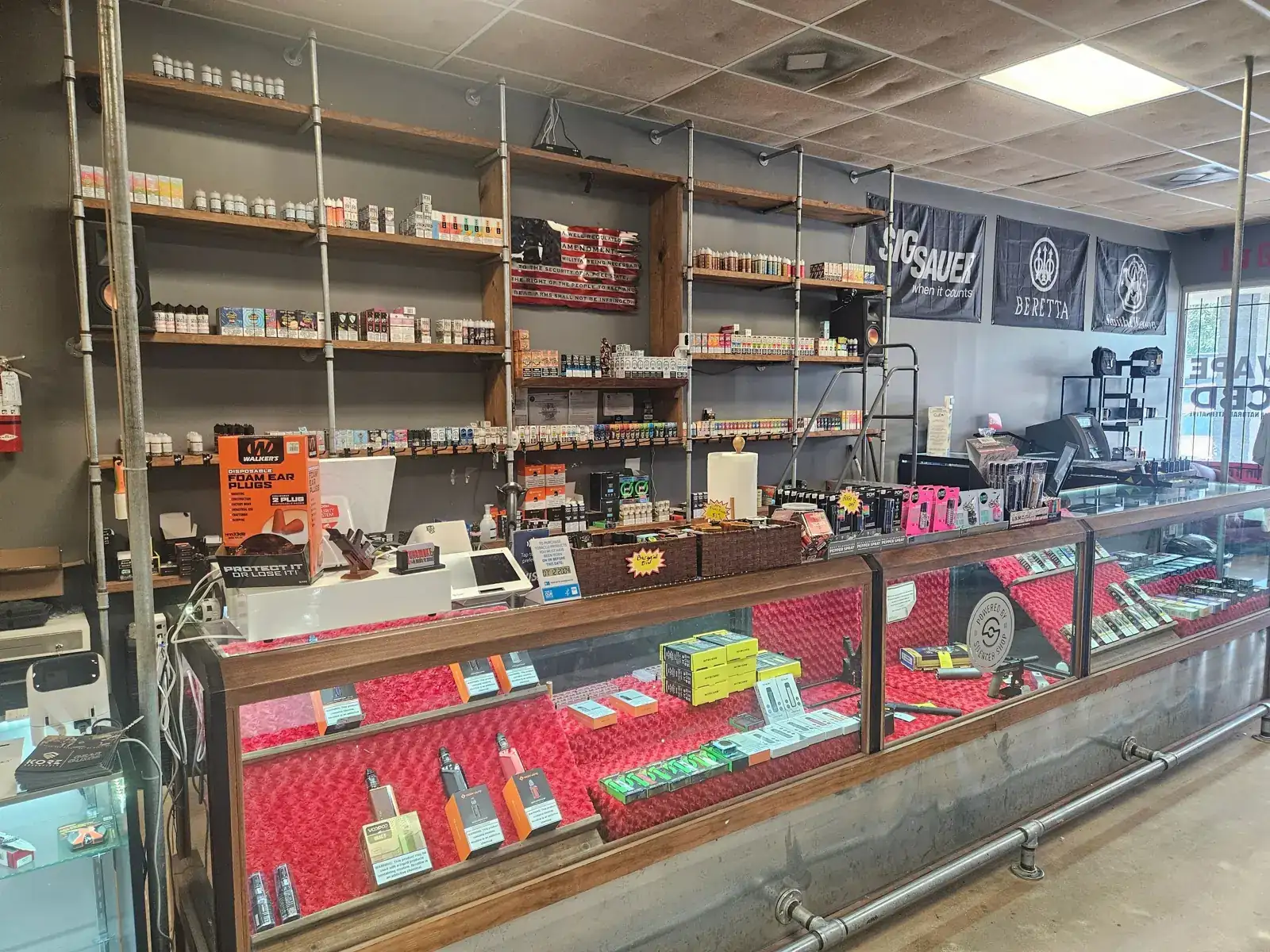 The vape counter and e-liquid shelves at Gunsmoke